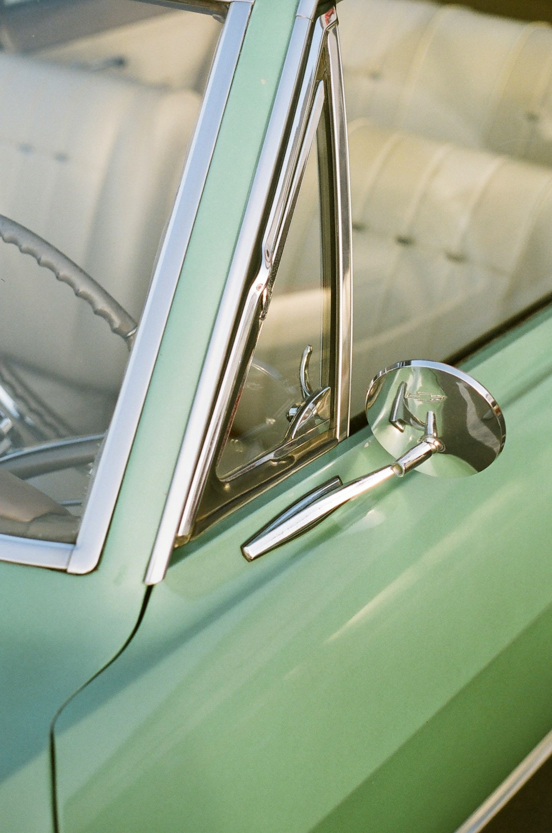 classic teal convertible car during daytime