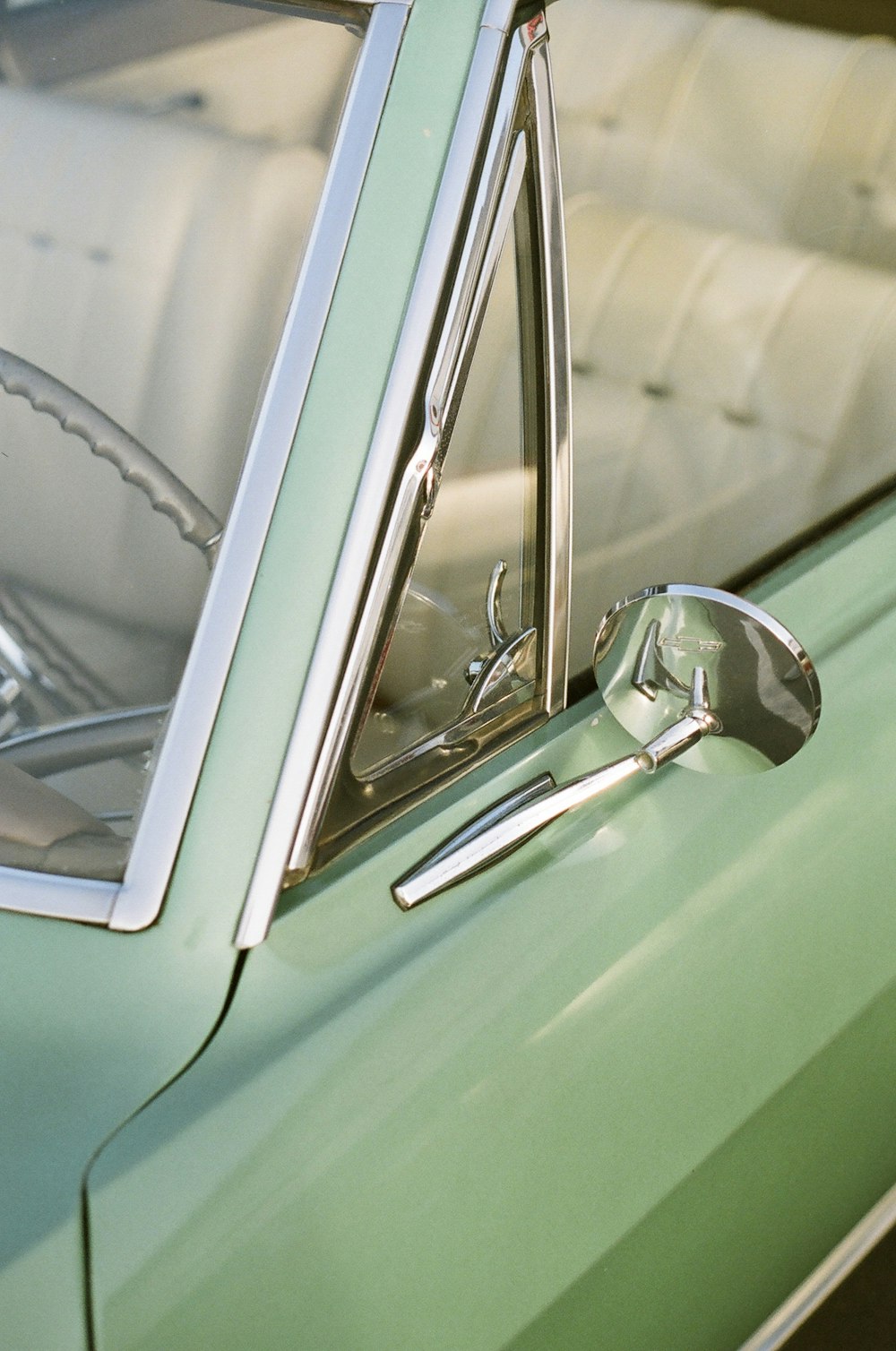 classic teal convertible car during daytime