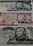 Three different Iranian banknotes featuring detailed engravings of a man's portrait dressed in military attire. The notes are adorned with intricate floral and scrollwork patterns, accompanied by Persian script.