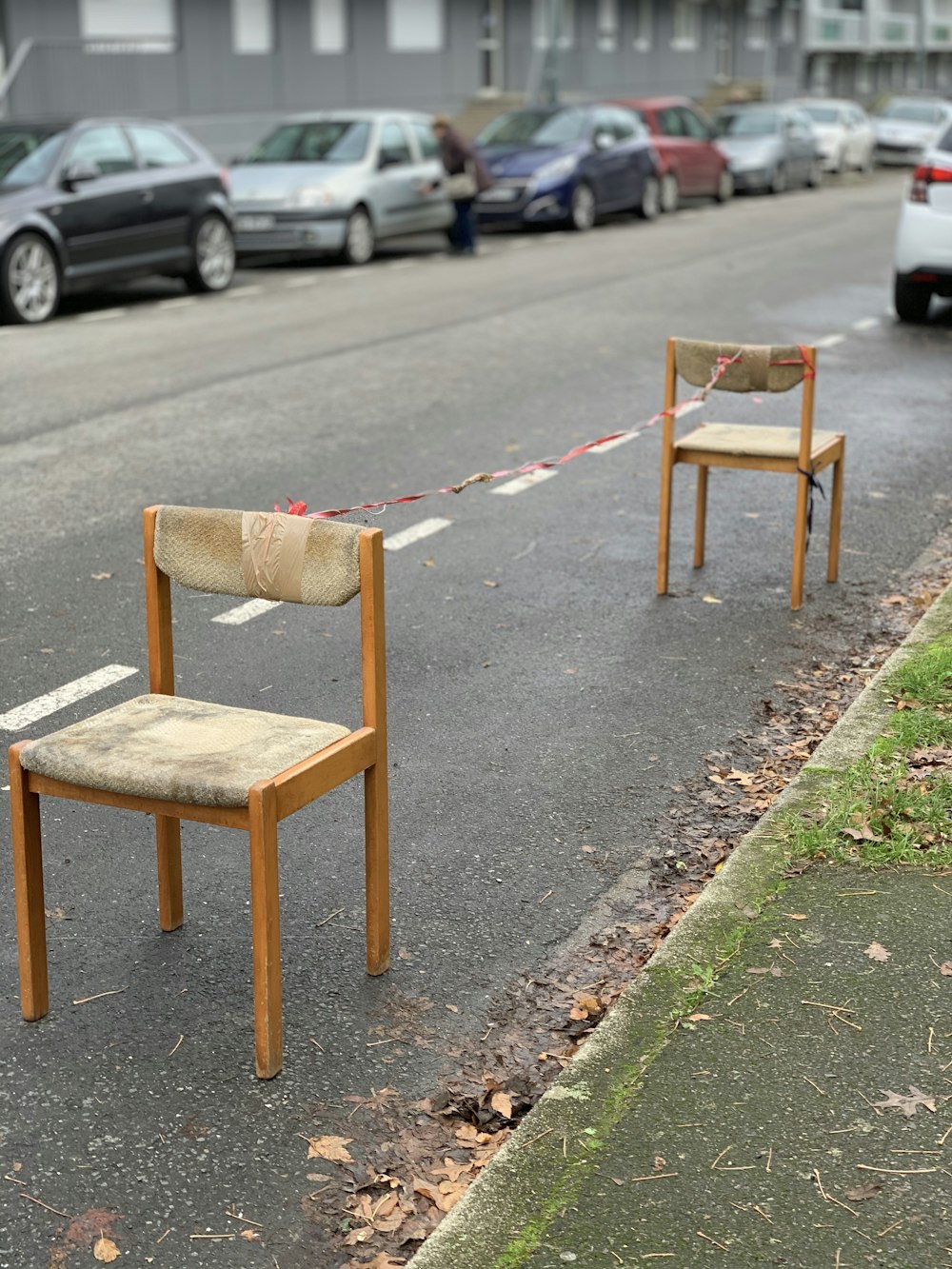 brown wooden chair on gray concrete road