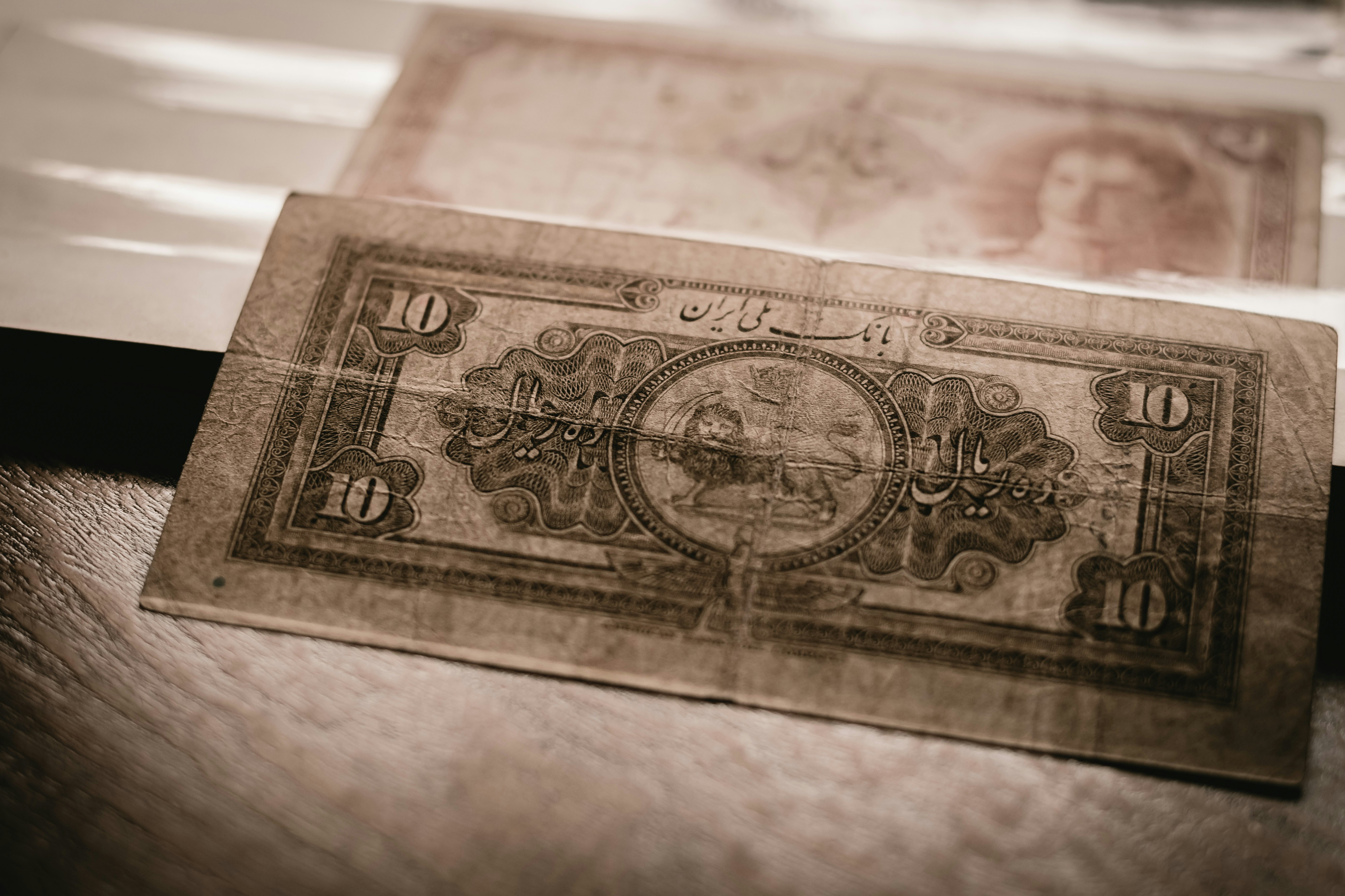 10 banknote on white surface