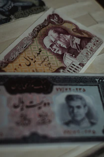 two banknotes on white surface
