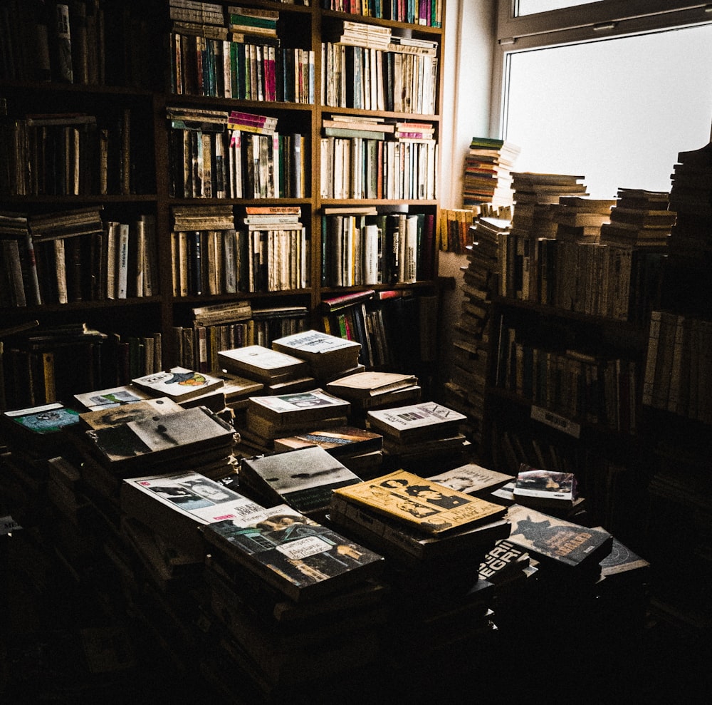 books on brown wooden shelf