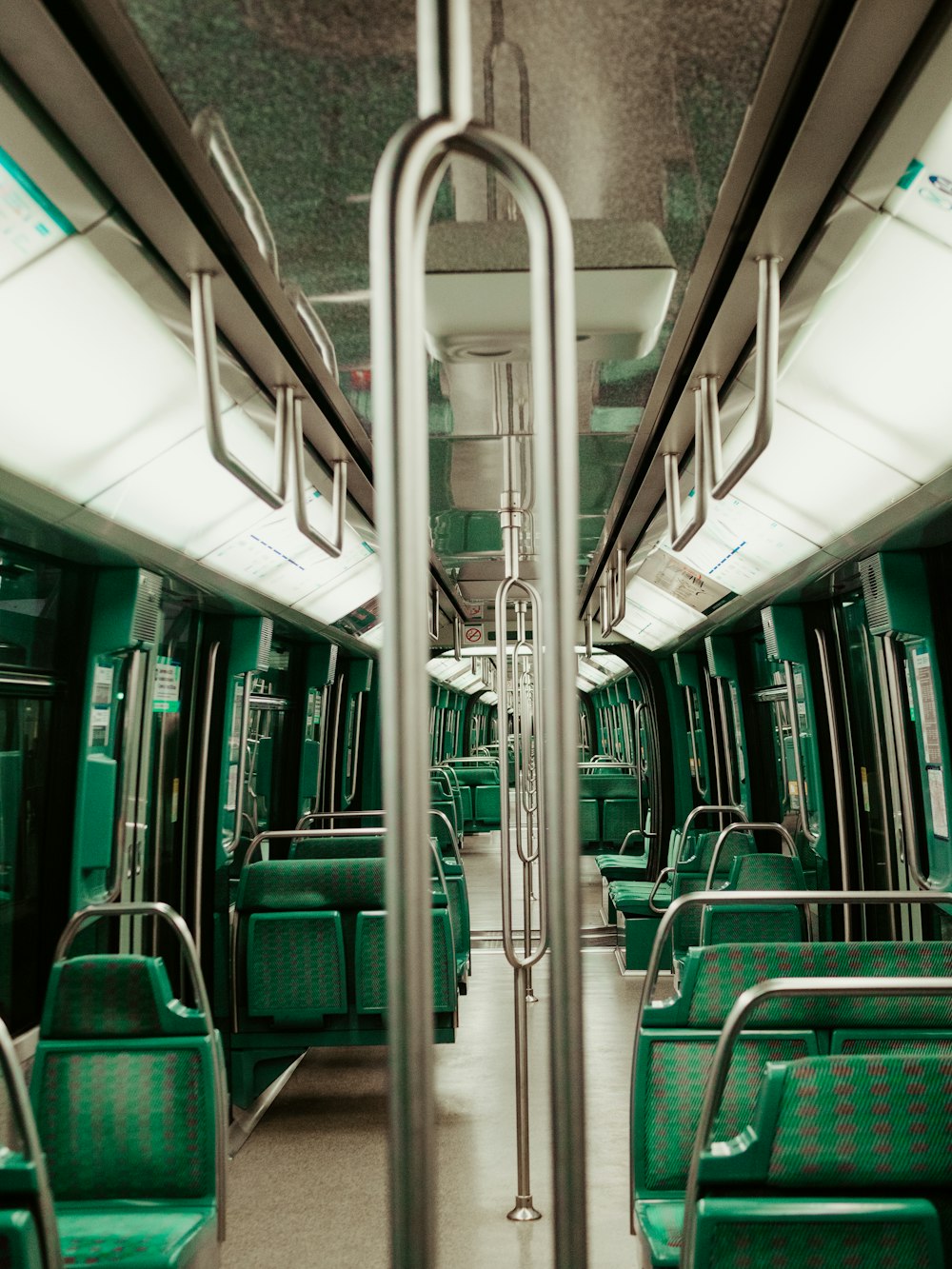 empty public train with turned on lights