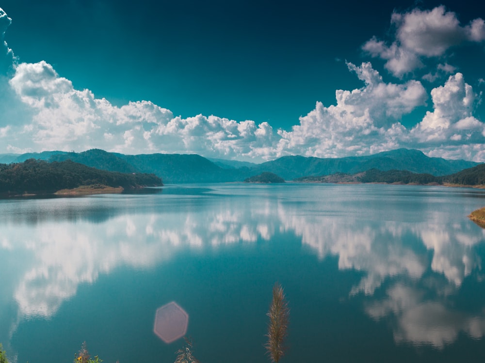 blue sky over lake and mountains