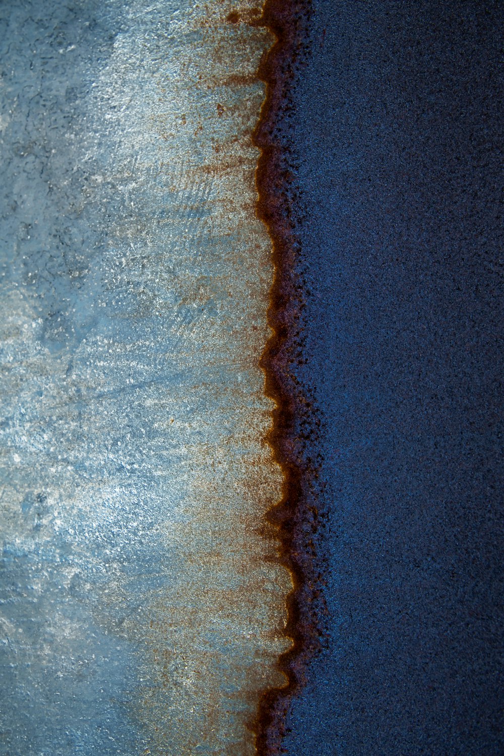 a close up of a water surface with a blue sky in the background