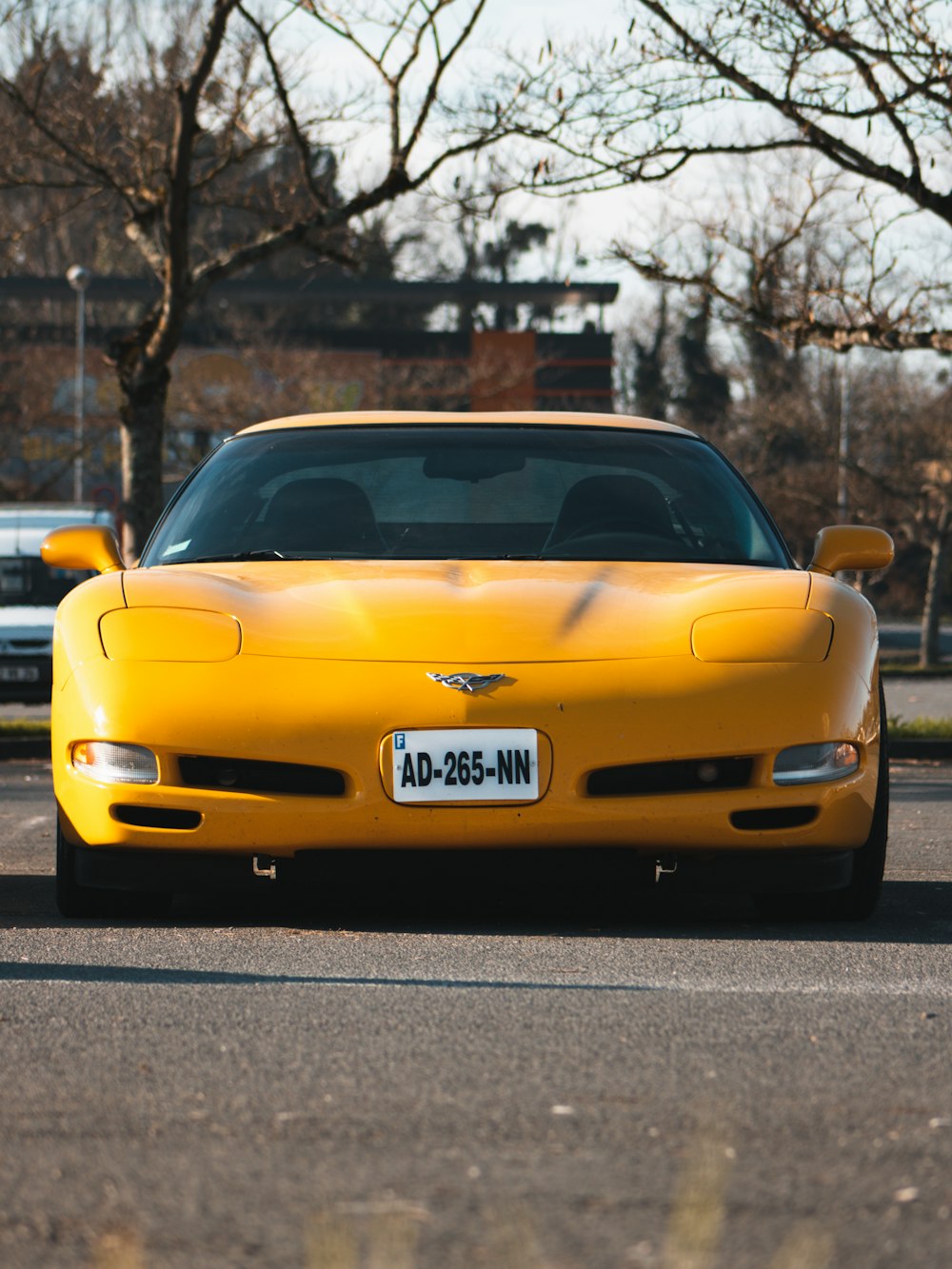 yellow chevrolet camaro on road during daytime