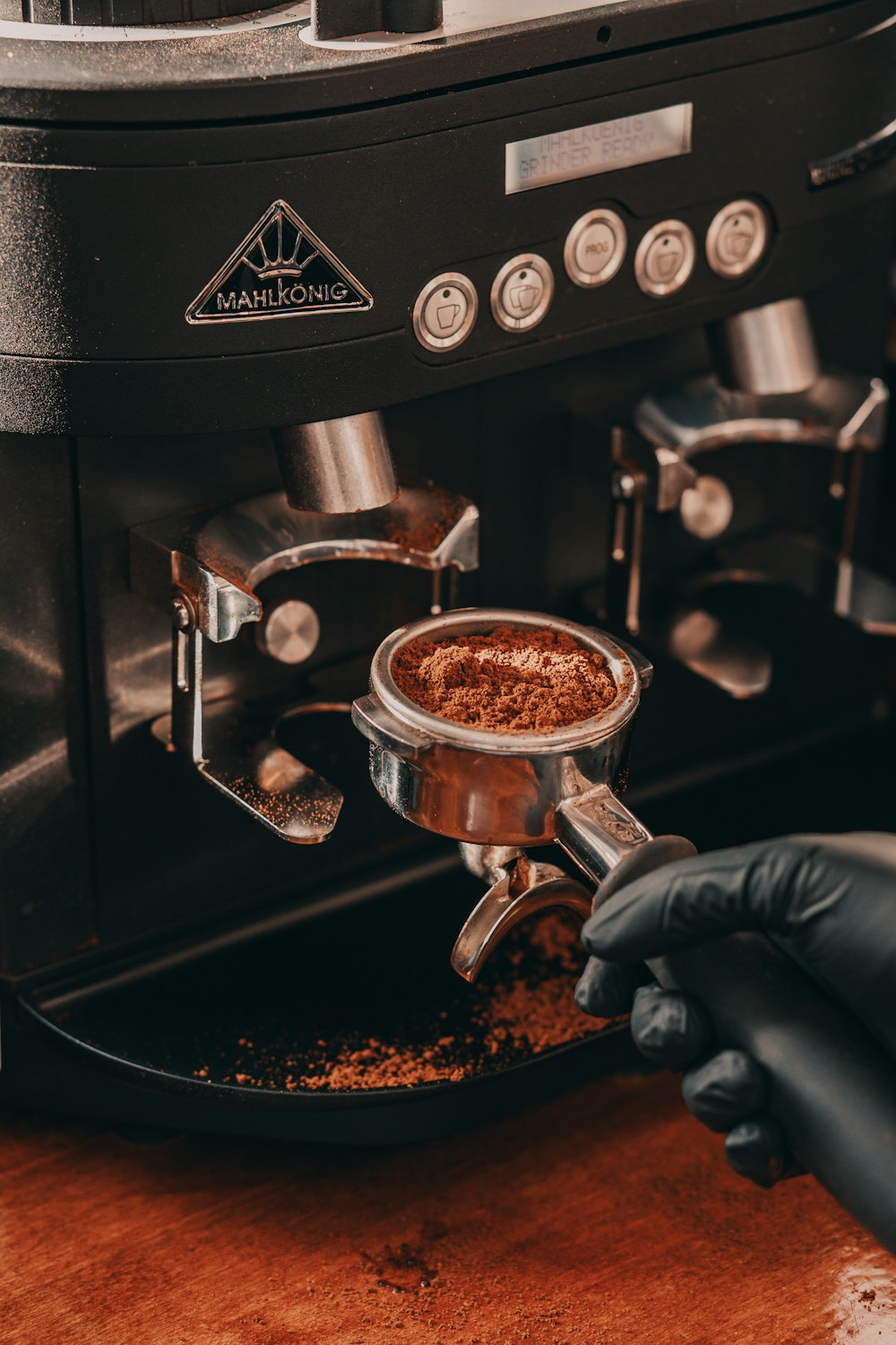 person holding coffee grinder