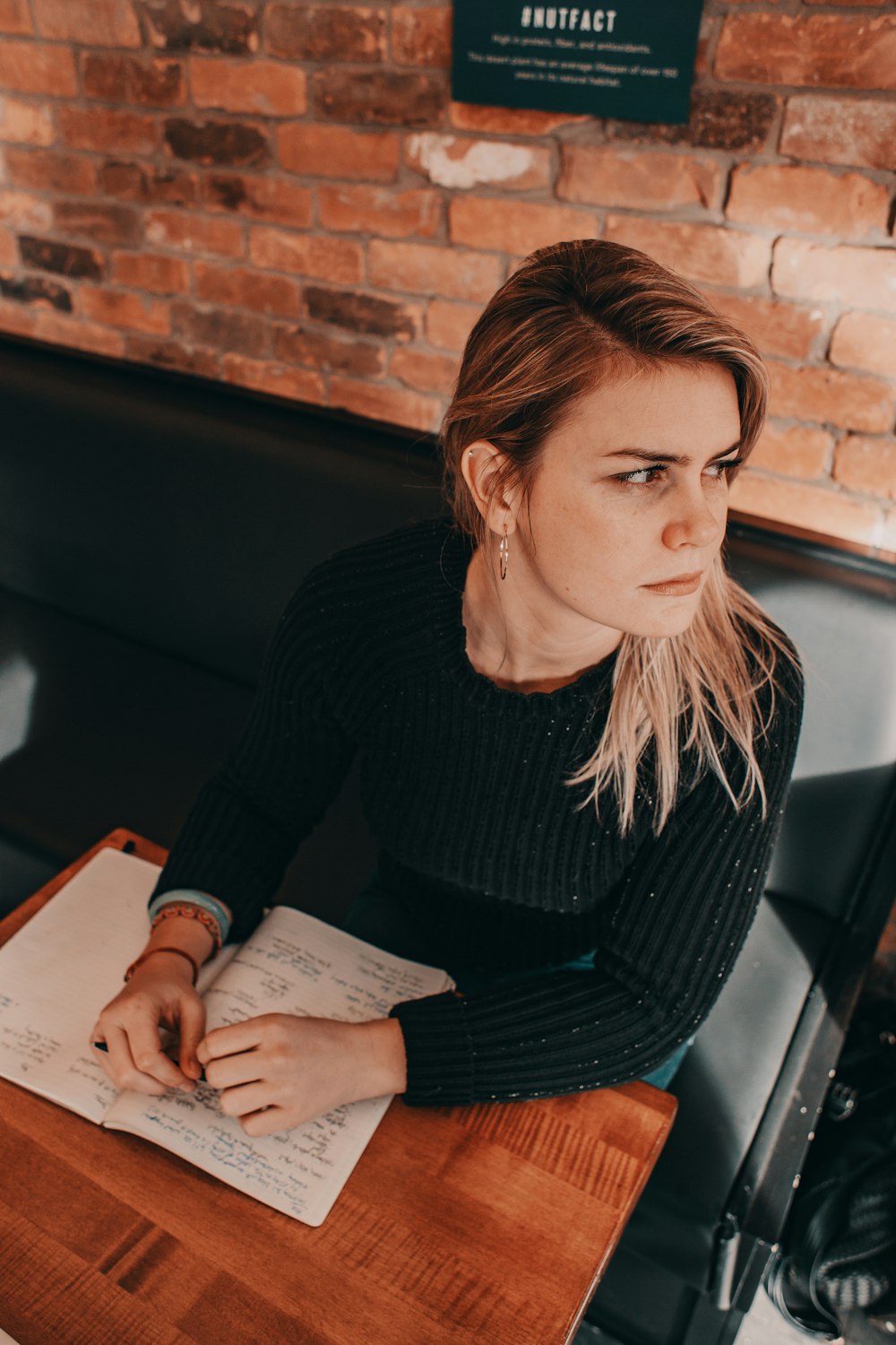 woman sitting beside table