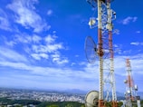 red and white metal tower under blue sky during daytime