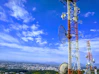 red and white metal tower under blue sky during daytime