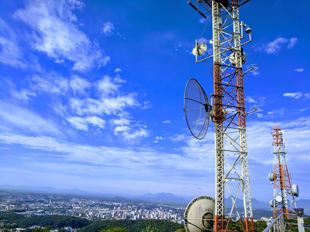 red and white metal tower under blue sky during daytime