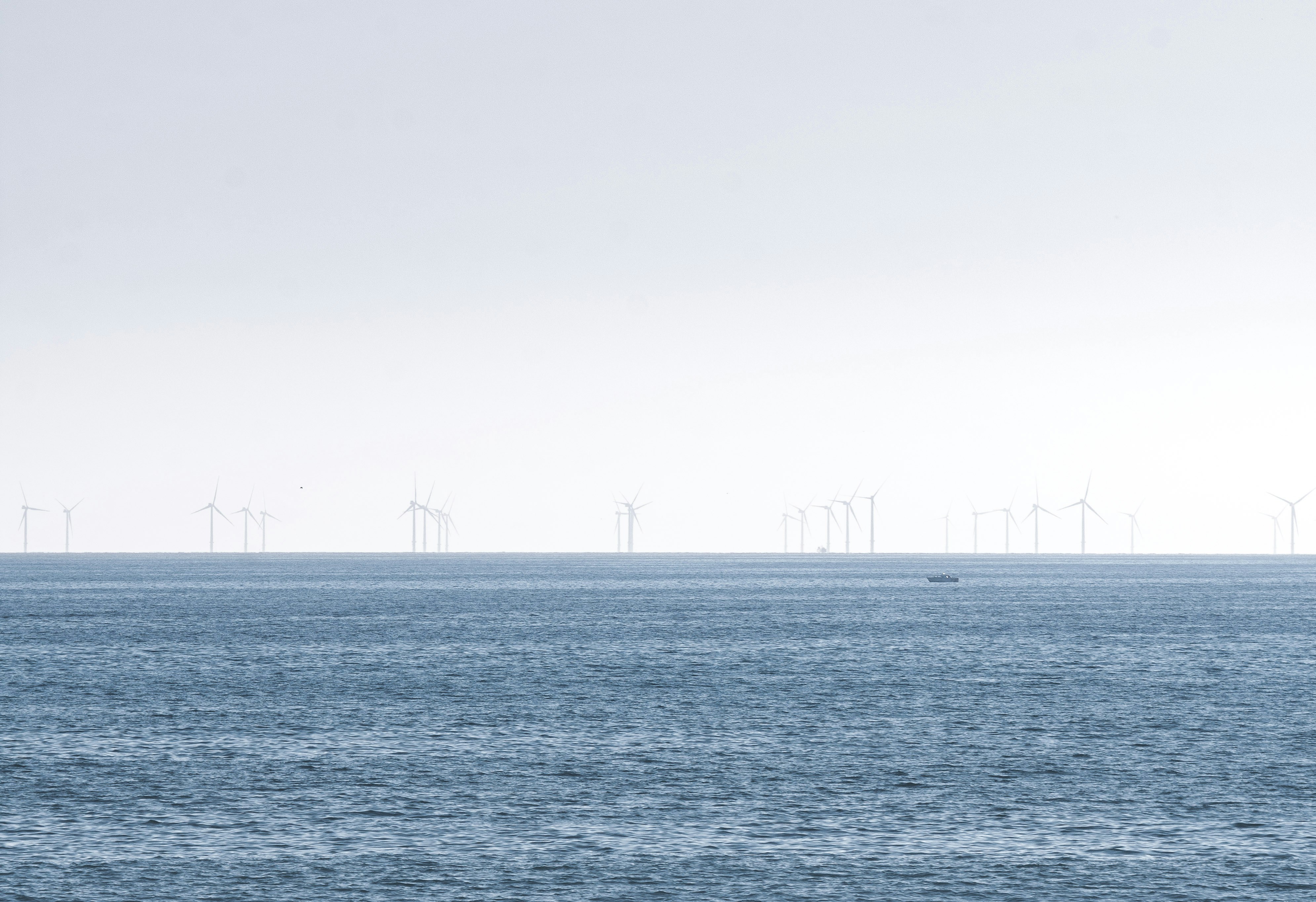 body of water under gray sky