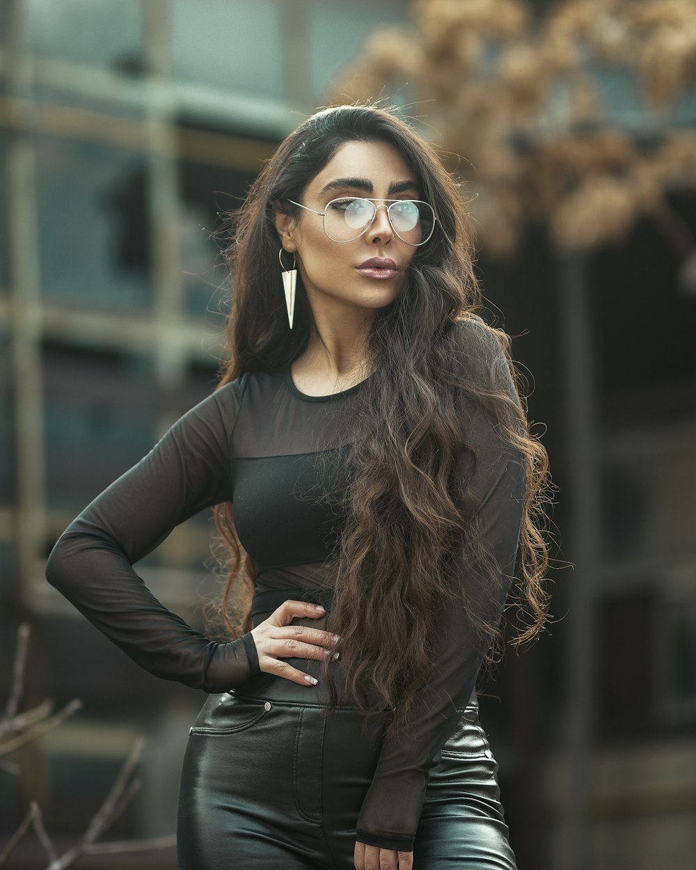 selective focus photography of woman standing near outdoor during daytime