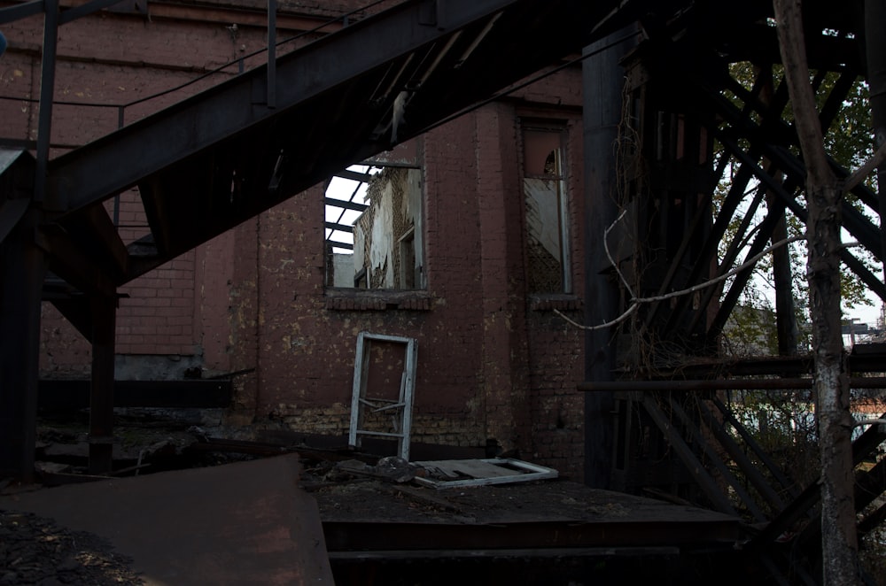 black metal structure beside building