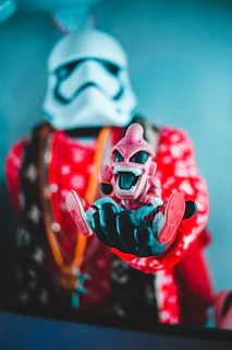 Founder holding a prized autographed mini helmet, sharing a smile that reflects their passion.