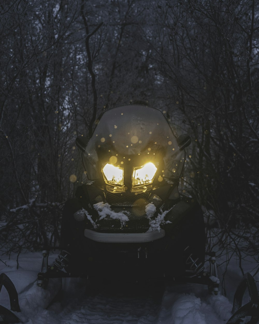 black vehicle on snow