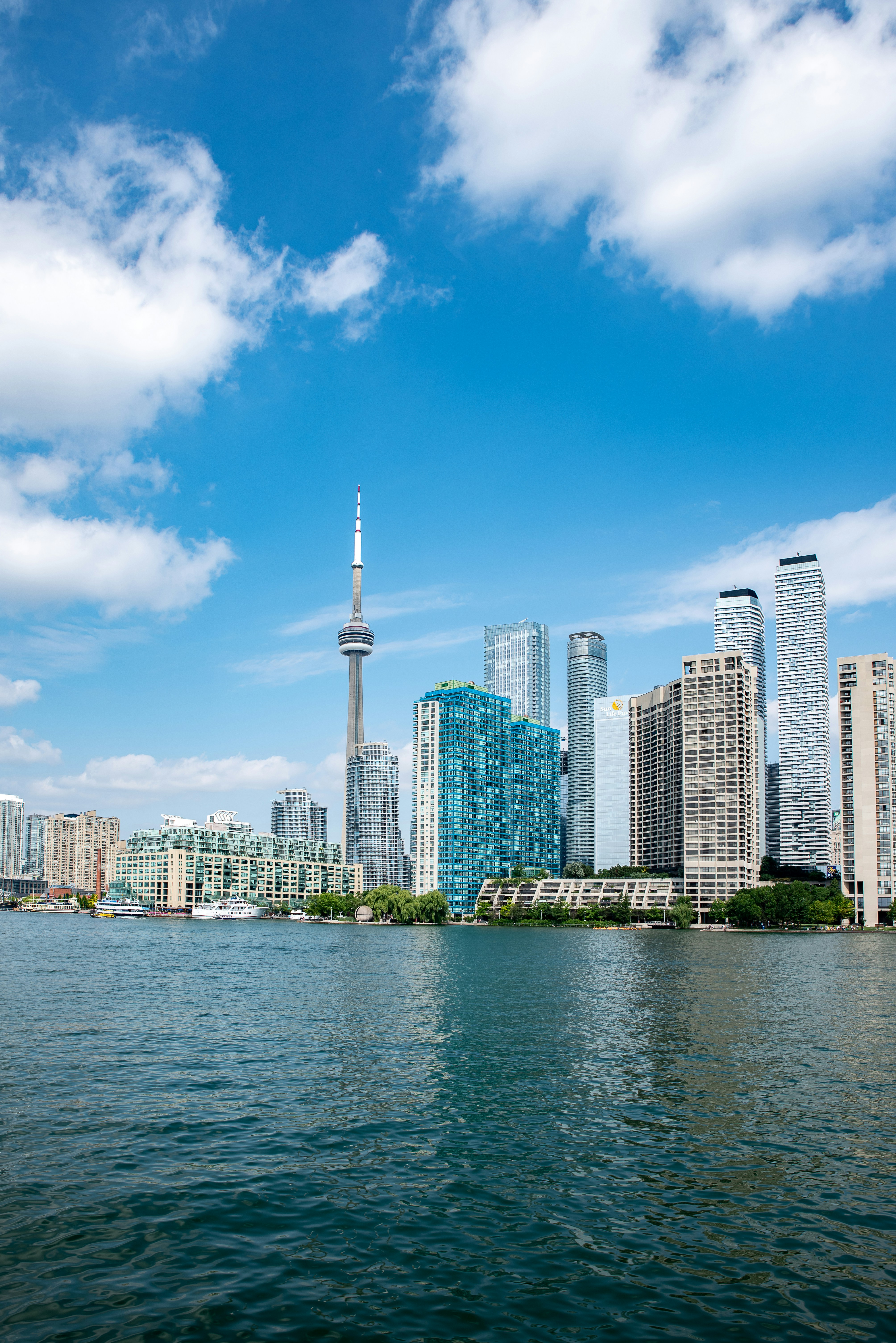 city skyline across body of water during daytime