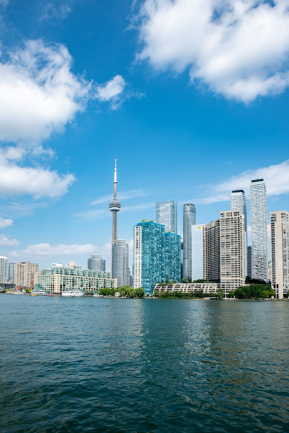 city skyline across body of water during daytime