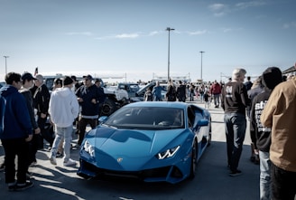An aerial view of a vibrant car show featuring various sports cars.