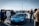 A vibrant gathering of car enthusiasts showcasing their vehicles.