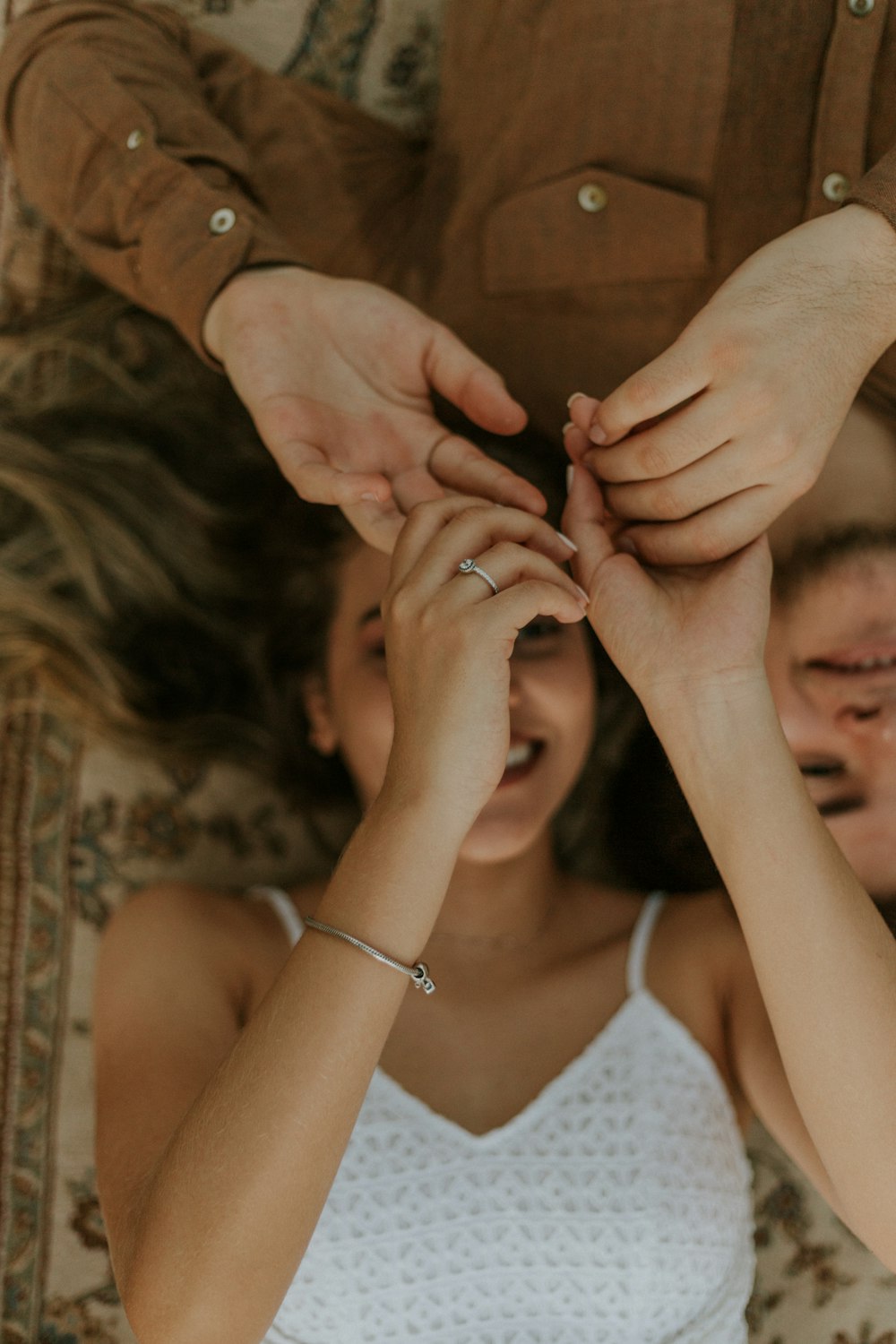 man and woman laying ground