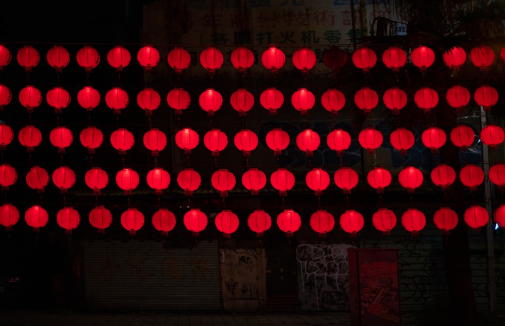 red paper lantern hanging near structure