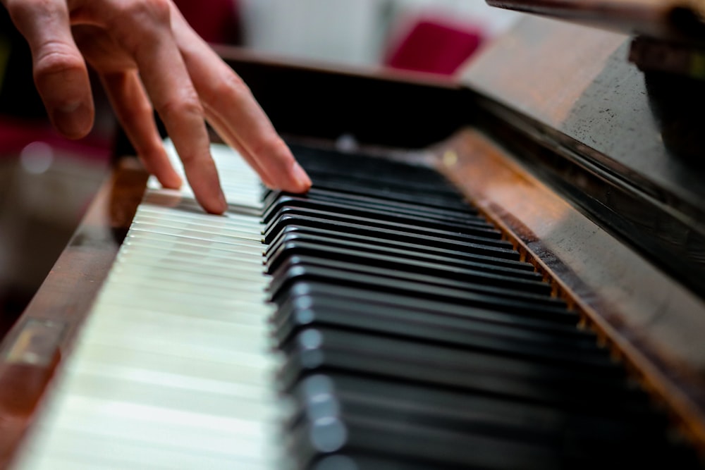 person playing black and white piano