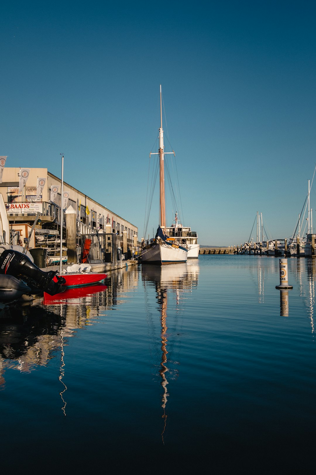 white boats on bod of water