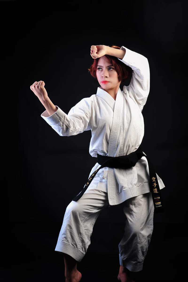 Karate students lined up performing a synchronised kata