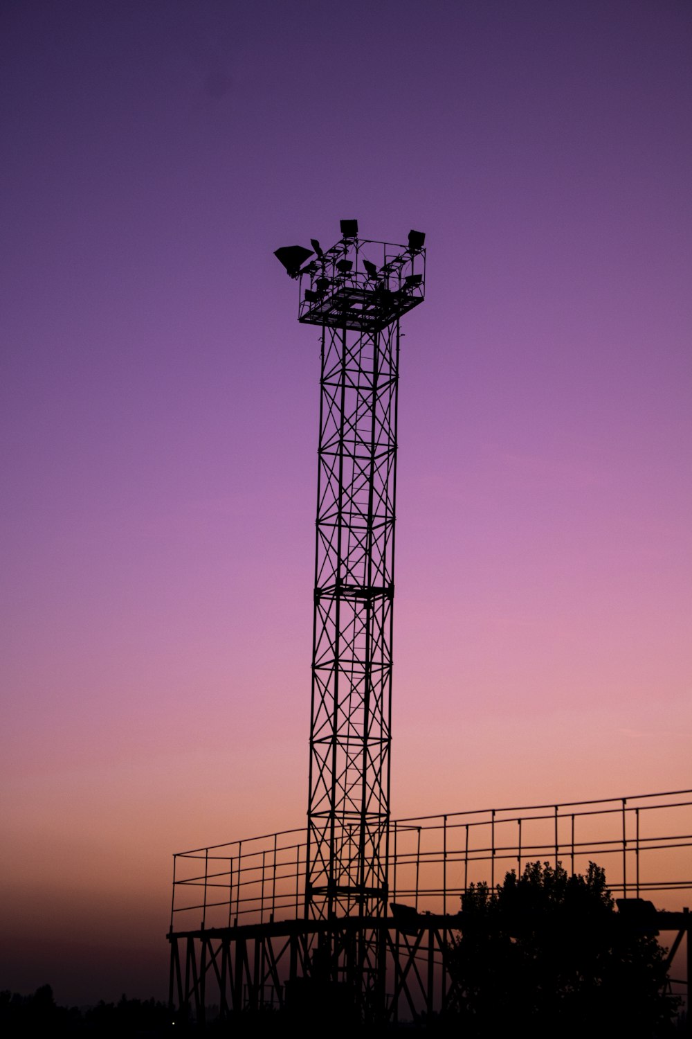 silhouette of tower during sunset