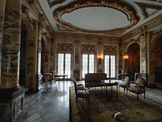 Luxurious spa room decorated with Egyptian pharaonic motifs and soft ambient lighting.