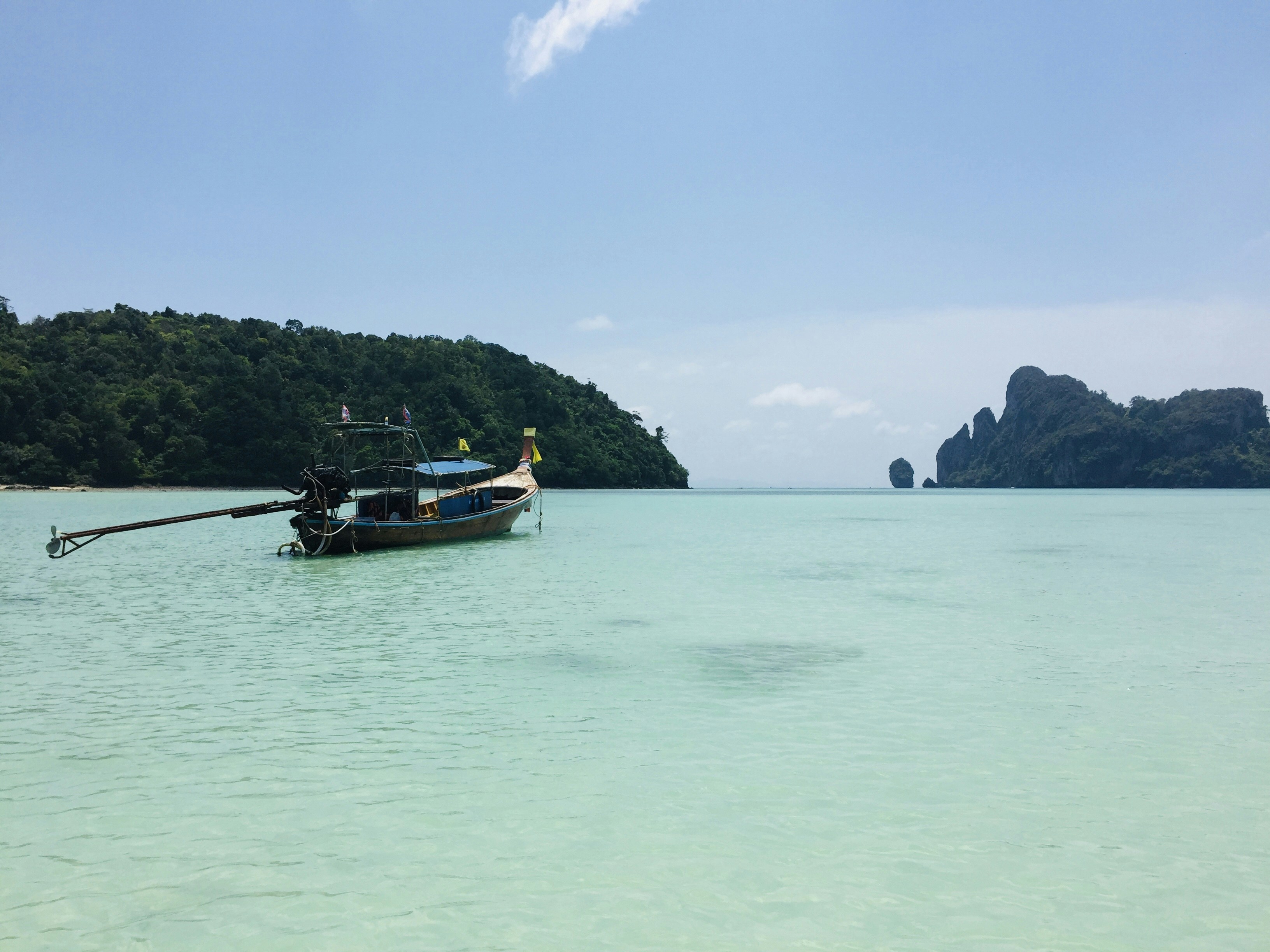 white and black boat on sea during daytime, Boat trip in Phi Phi.</p><p>Shot on iPhone 6.