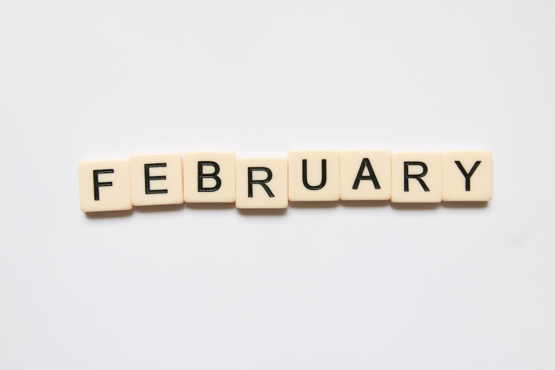 Scrabble tiles spell out "February" 