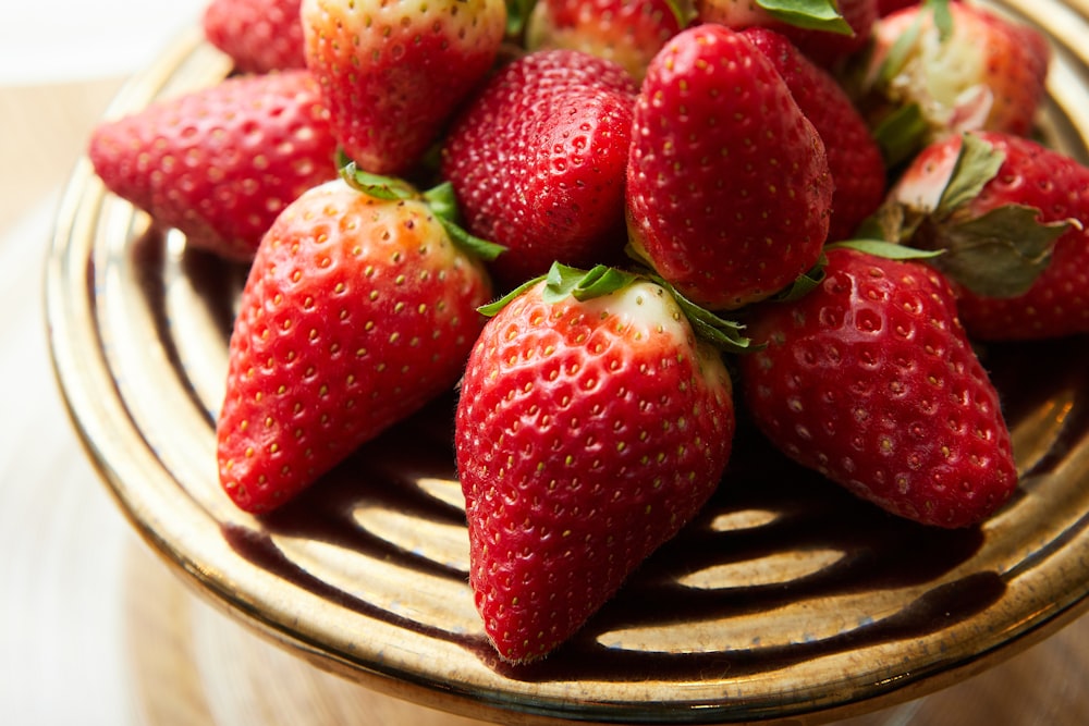 red strawberries on white and black stripe plate