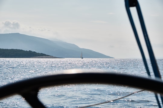 body of water near mountain during daytime in Hvar Croatia