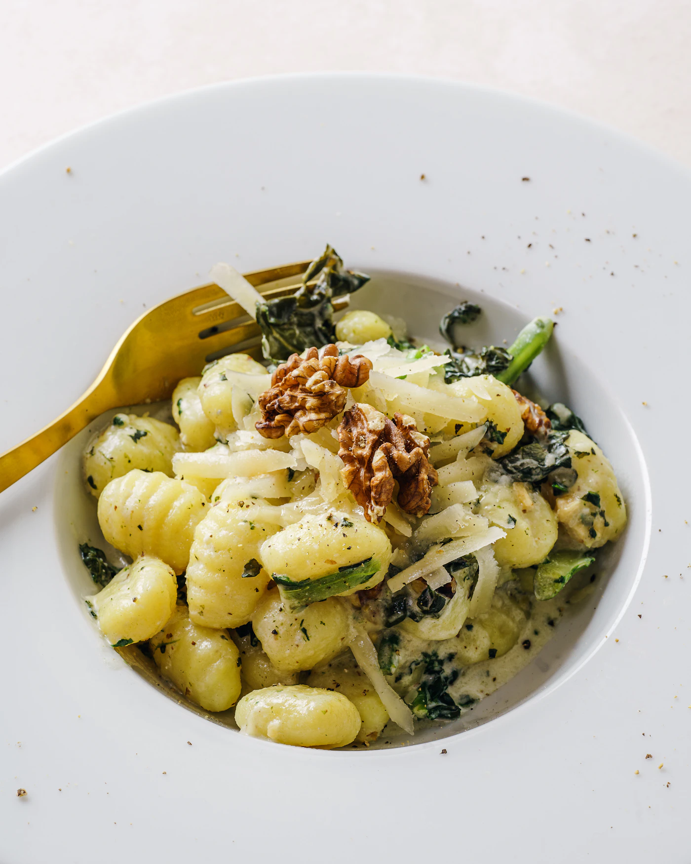 Brown butter gnocchi with kale walnuts Parmesan and sage