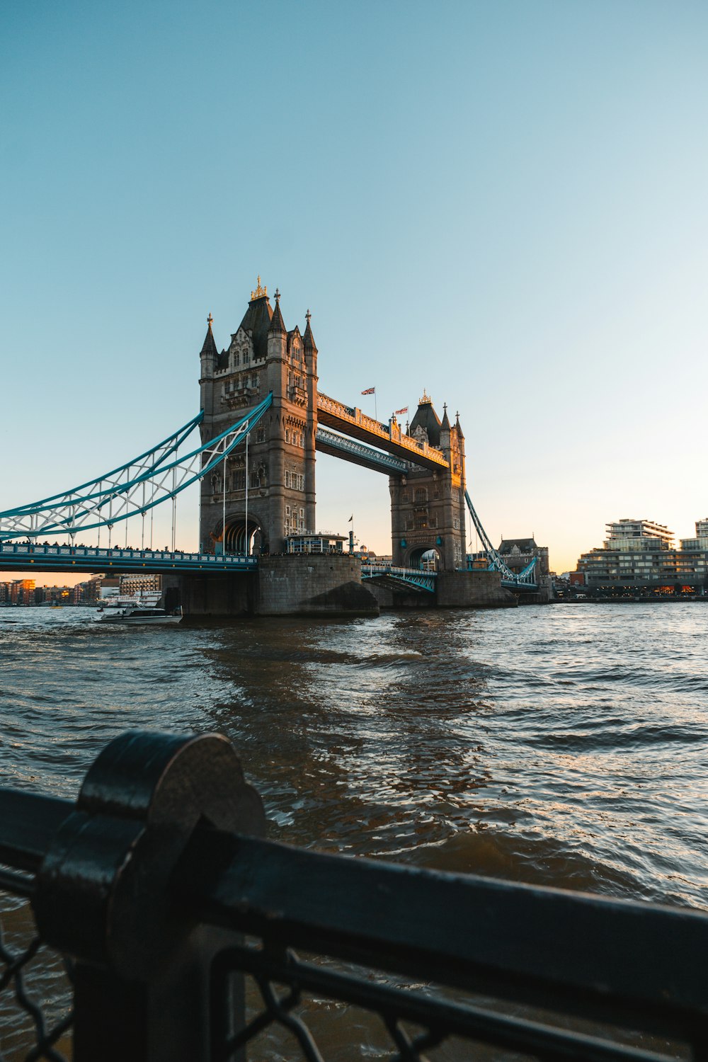 brown bridge over body of water during daytime