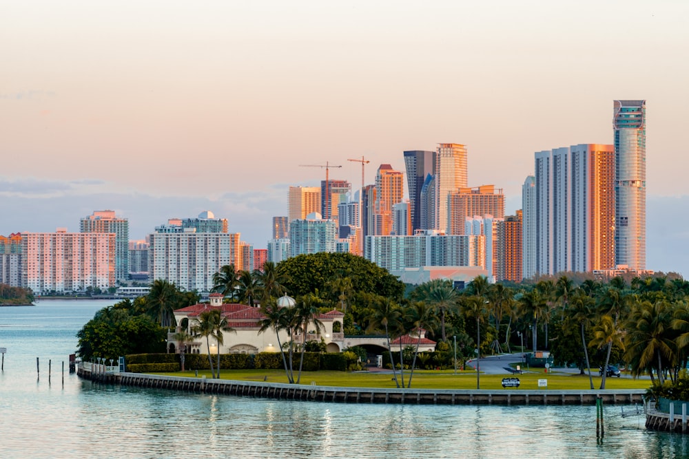 city skyline across body of water during daytime