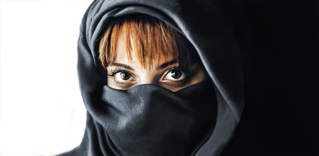 brown haired woman in black hijab