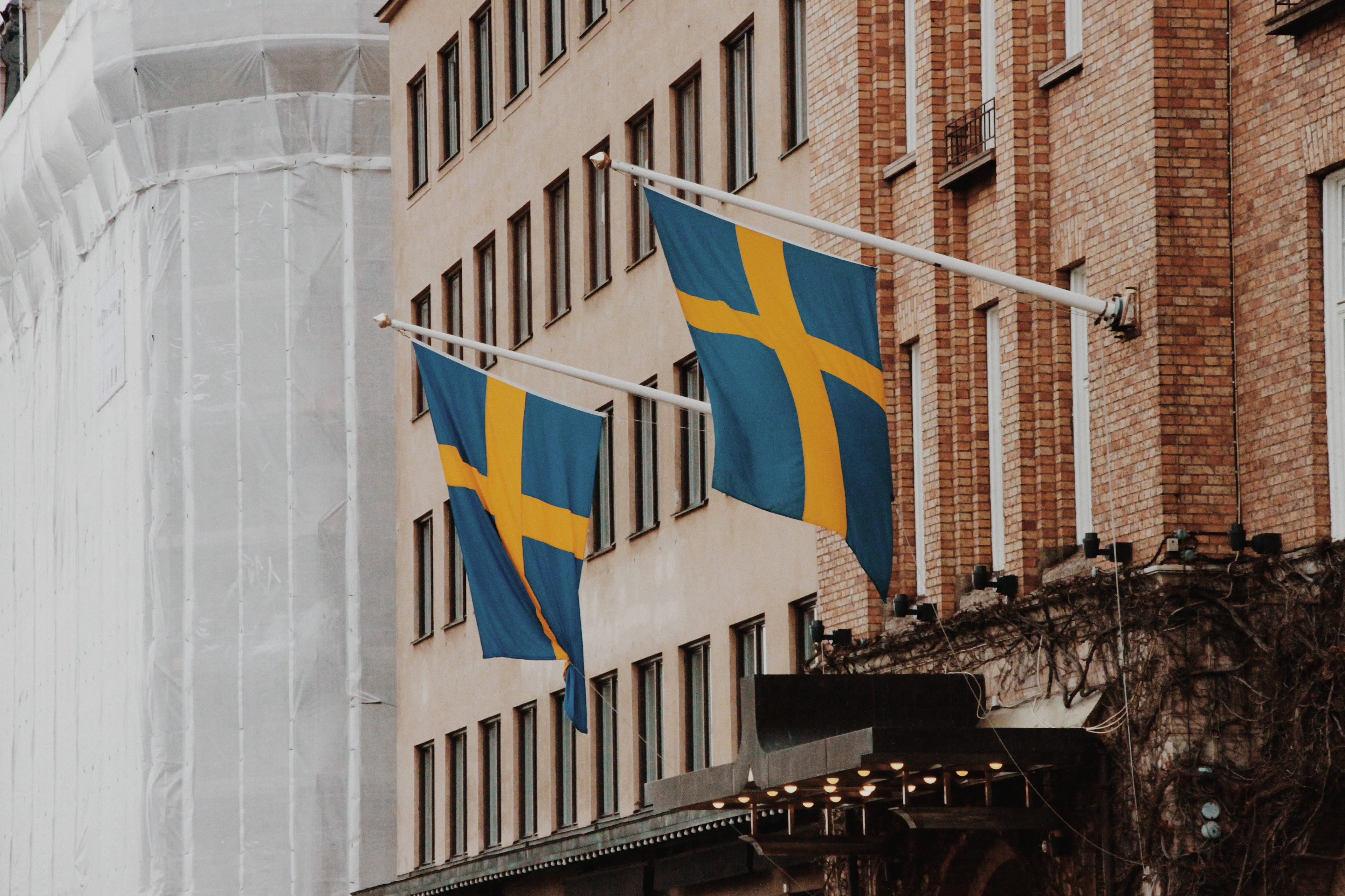 Swedish flags above a Gamla Stan street