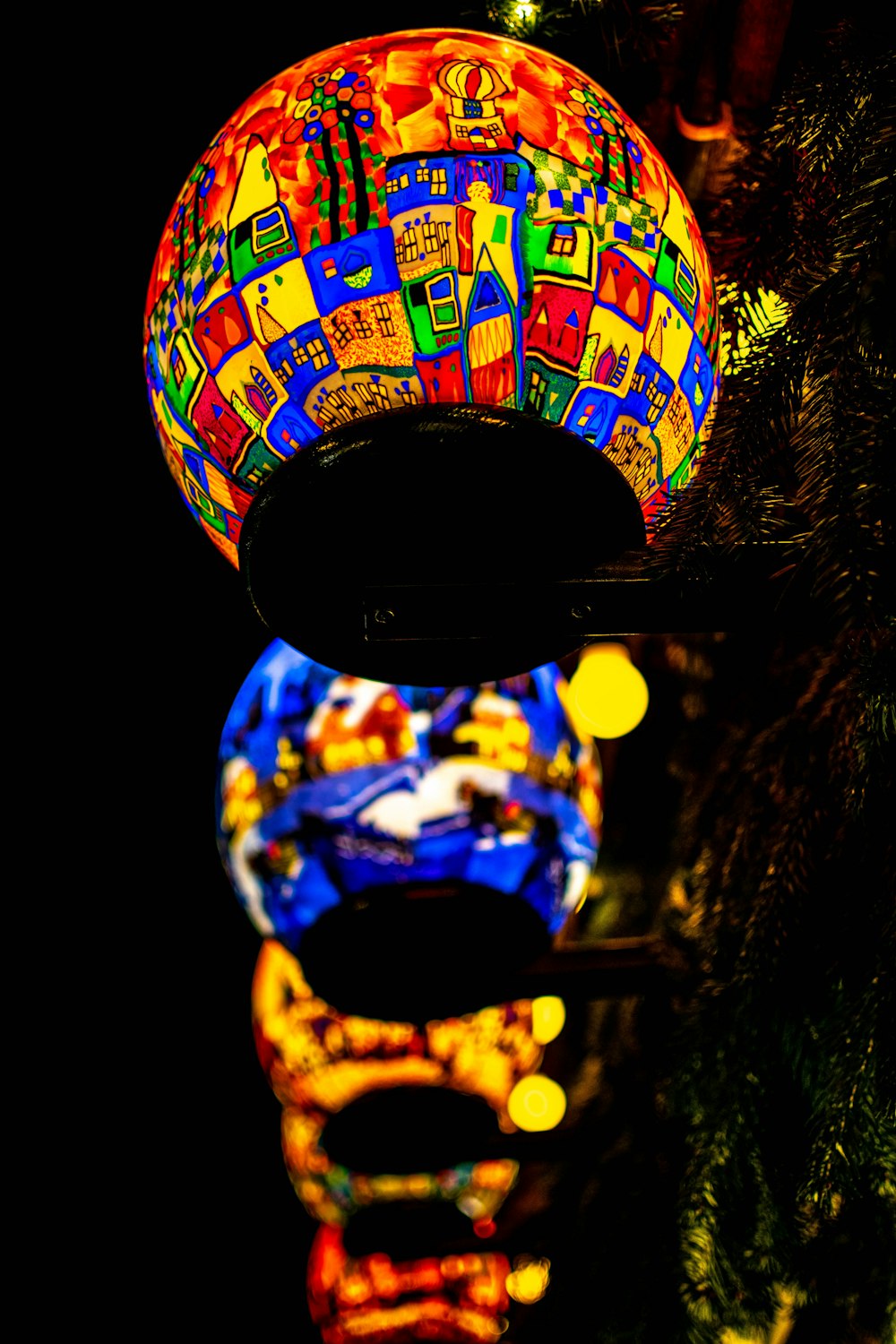 a colorful object sitting on top of a tree