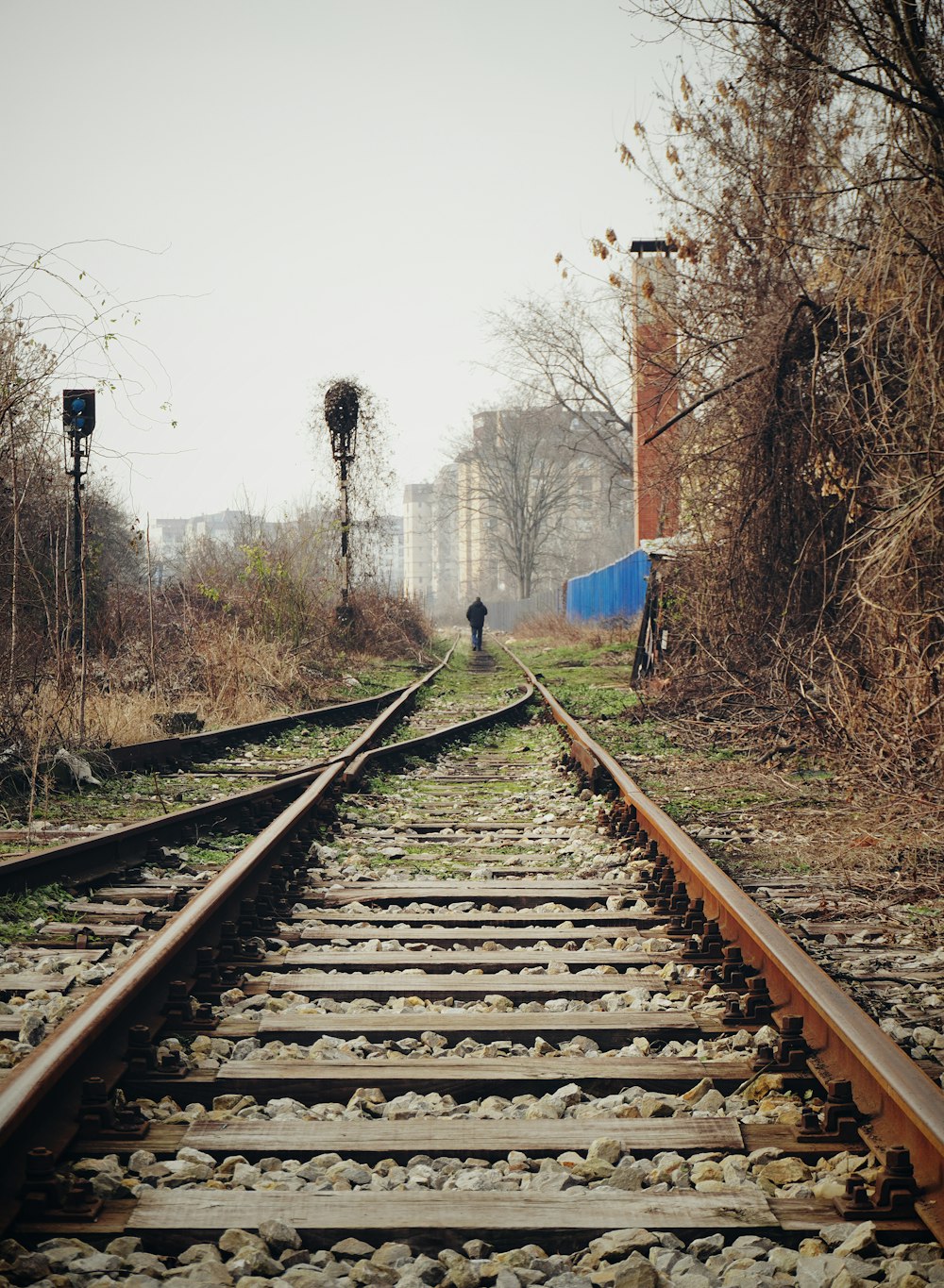 a train track with a person walking on it