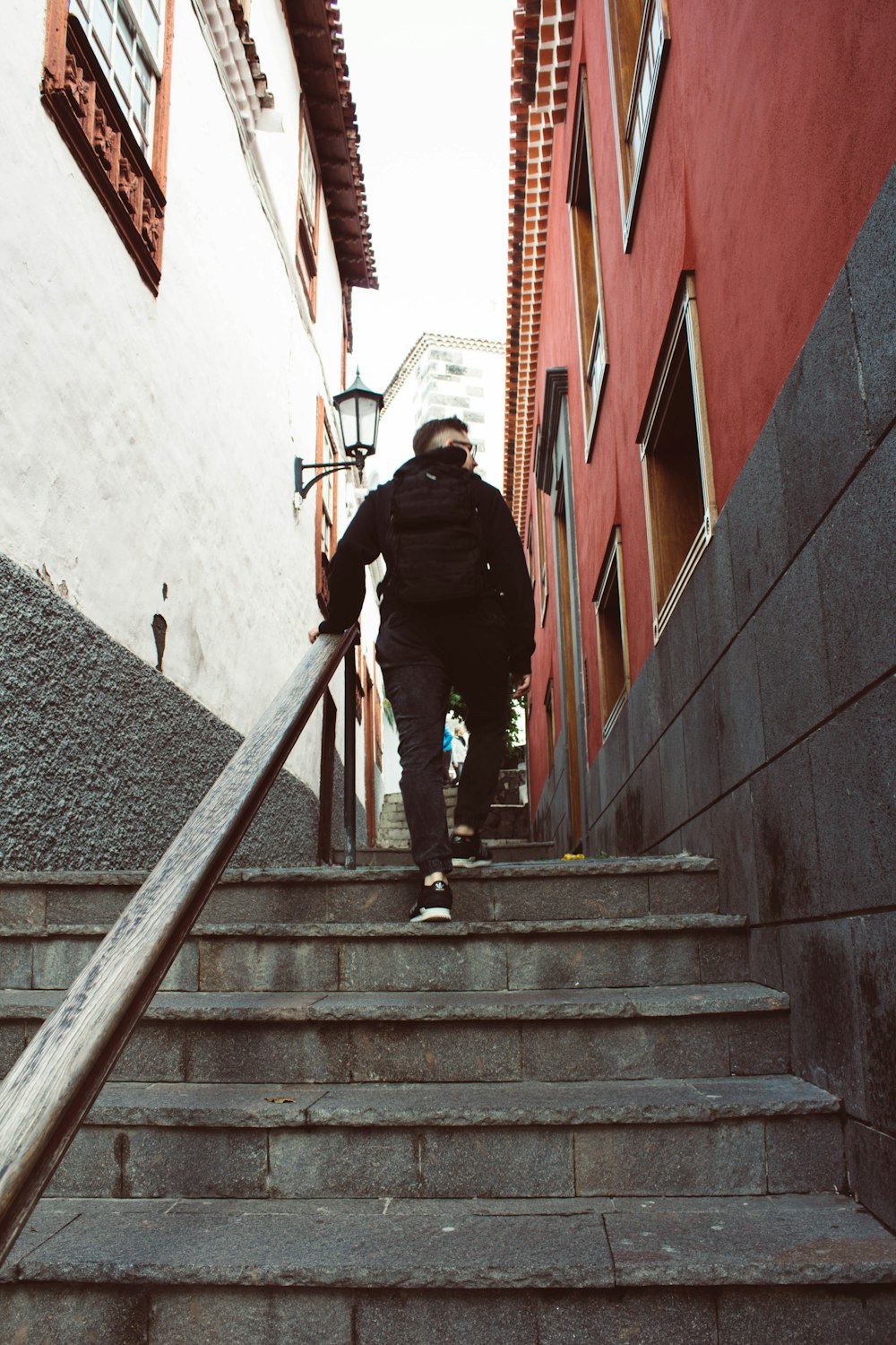 a man walking up a flight of stairs