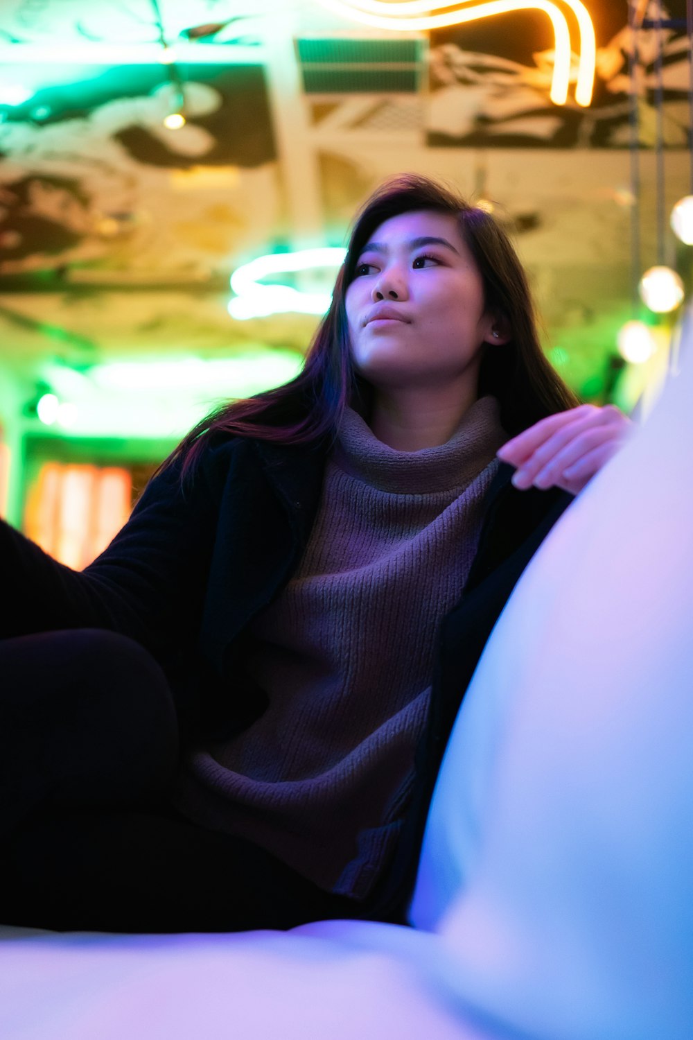 a woman sitting on a couch in a room