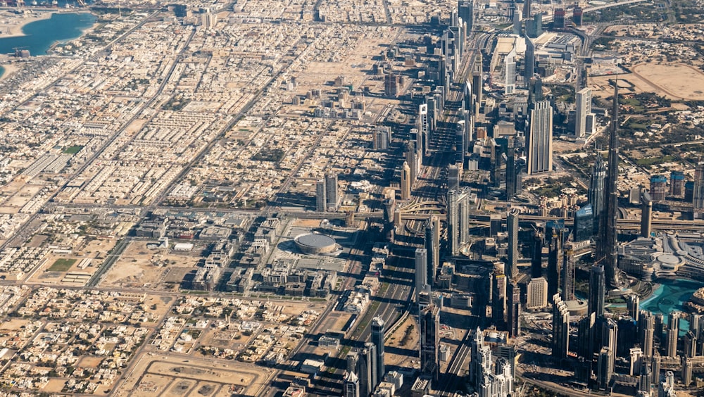 an aerial view of a city with lots of tall buildings