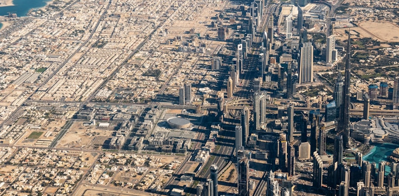 an aerial view of a city with lots of tall buildings