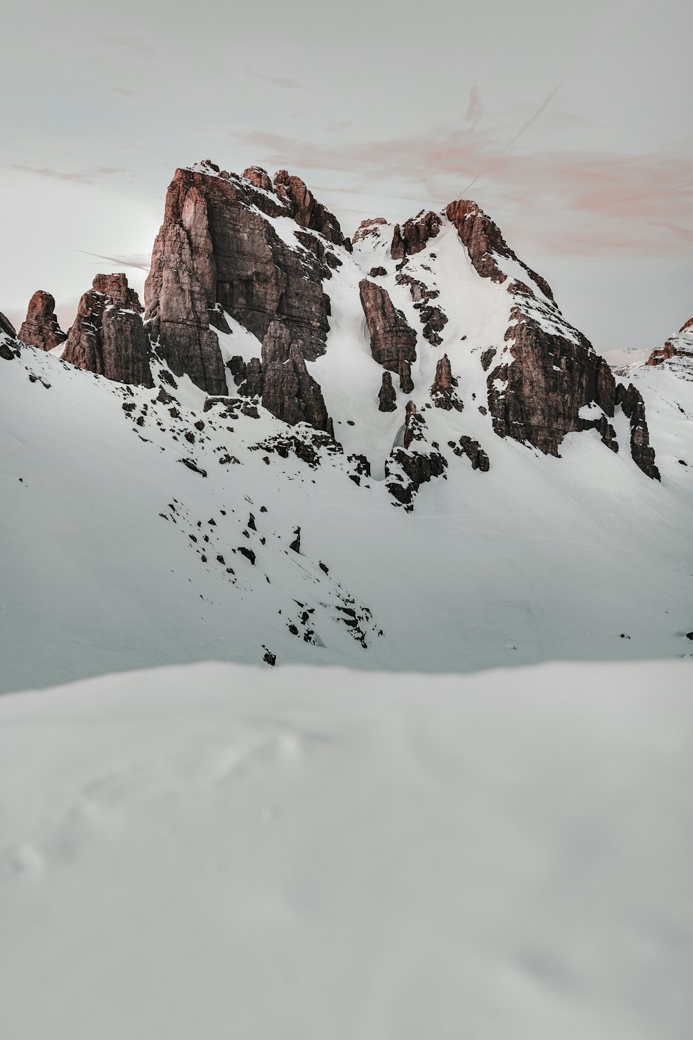 a snow covered mountain with a sky background