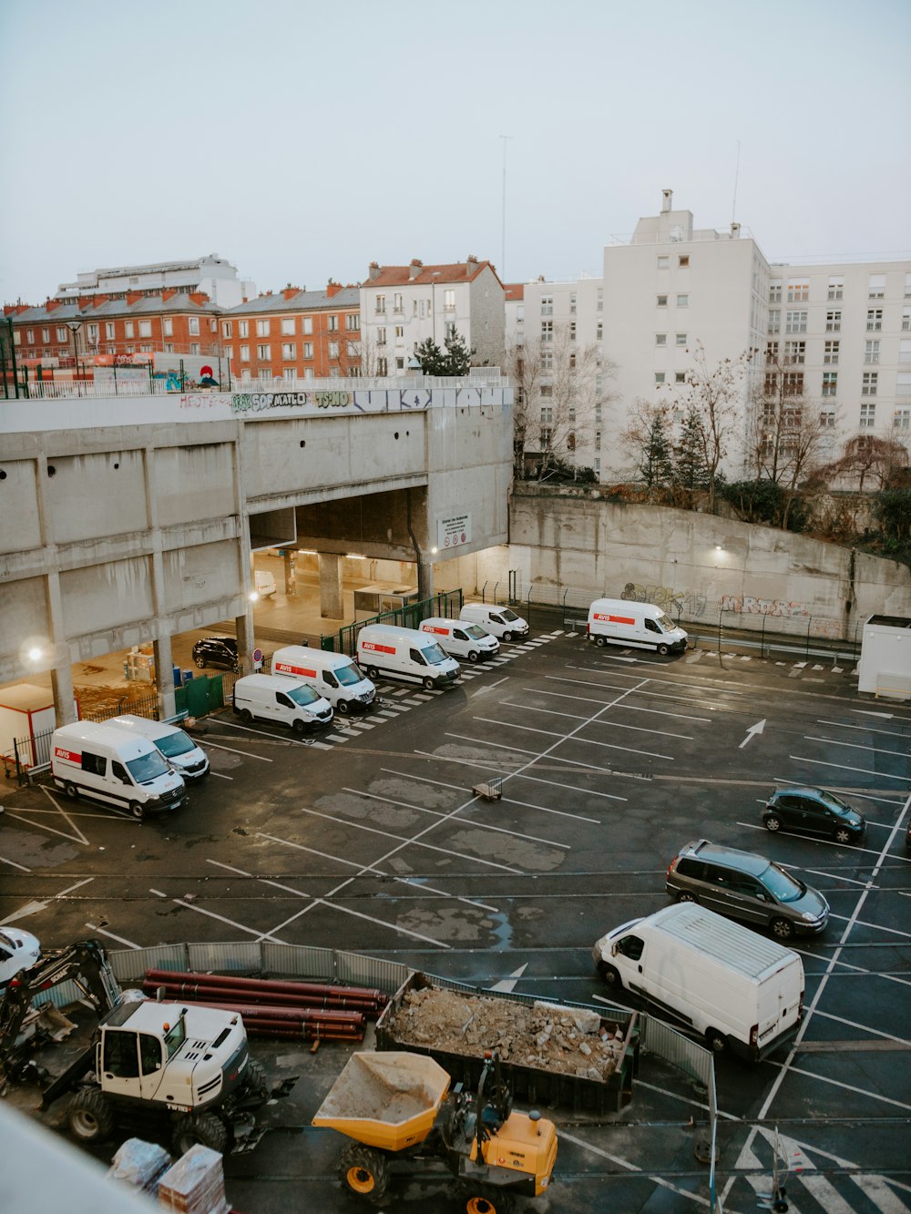 a parking lot filled with lots of parked cars