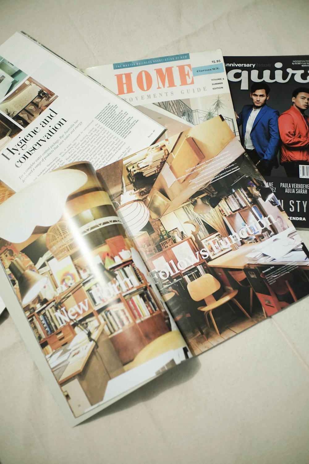 a bunch of magazines sitting on top of a table